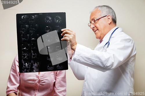 Image of Senior Radiologist Holding X-ray