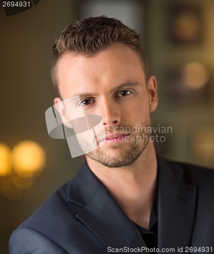 Image of Young Businessman At Coffeeshop