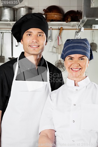 Image of Happy Chefs In Industrial Kitchen