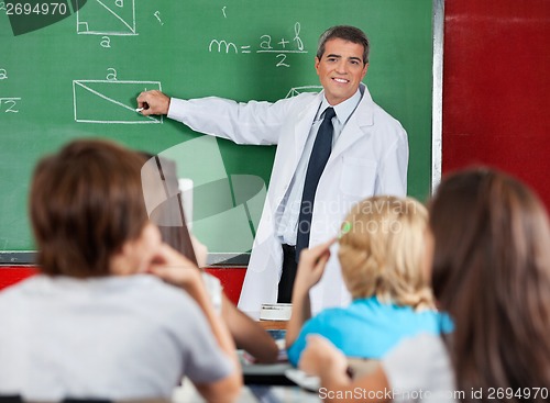 Image of Teacher Teaching Geometry To Schoolchildren