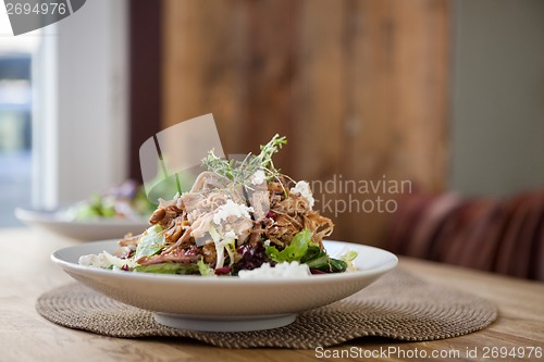 Image of Tasty Chicken Cuisine In Plate At Table