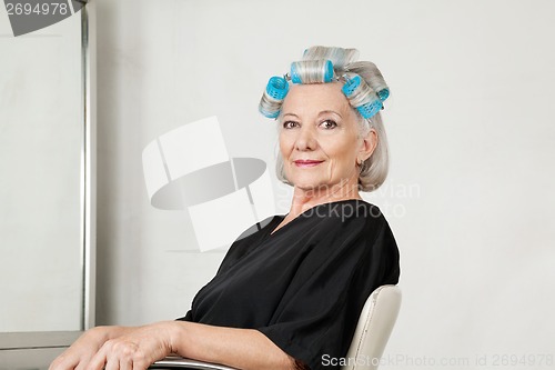 Image of Female Client With Hair Curlers At Salon