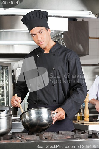 Image of Confident Chef Preparing Food