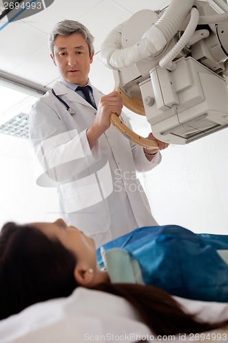 Image of Radiologist Looking At Female Patient