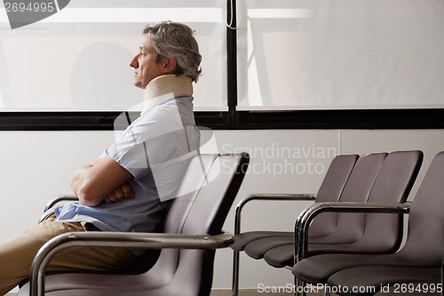 Image of Man With Neck Injury Waiting In Lobby