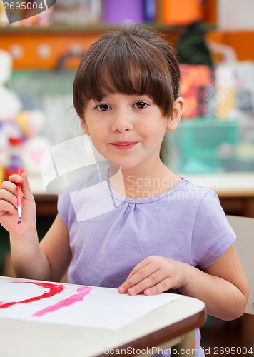 Image of Cute Little Girl Painting In Art Class