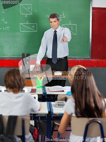 Image of Teacher Pointing At Students In Classroom