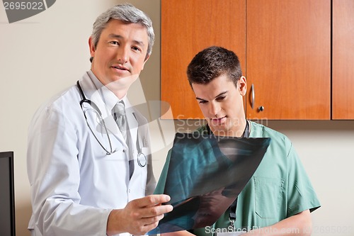 Image of Radiologist Standing With Male Technician