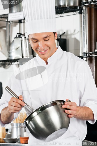 Image of Chef With Wire Whisk And Mixing Bowl