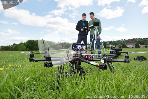 Image of UAV Octocopter And Technicians At Park