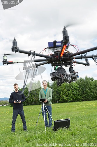 Image of Technicians Flying UAV Spy Drone