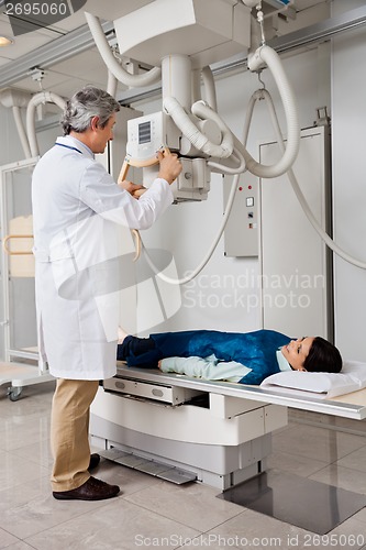 Image of Female Going Through X-ray Test