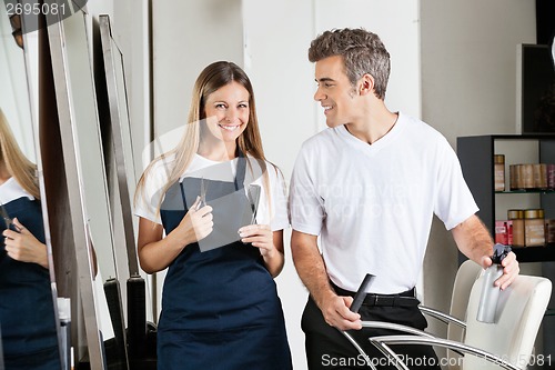 Image of Hairstylist With Colleague In Salon