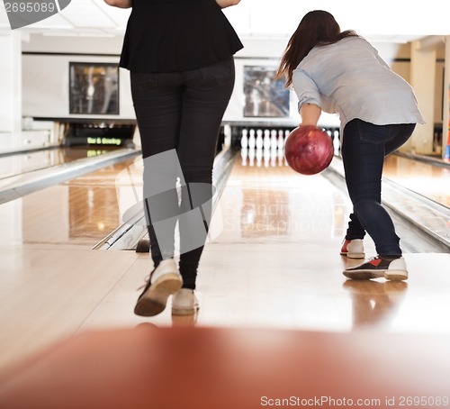 Image of Women Playing in Bowling Alley