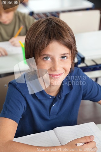 Image of Cute Schoolboy Smiling In Classroom