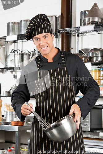 Image of Male Chef Holding Wire Whisk And Mixing Bowl