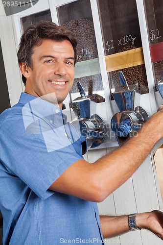 Image of Male Customer Standing By Coffee Vending Machine