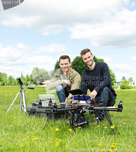 Image of Engineers With Laptop And Digital Tablet By UAV