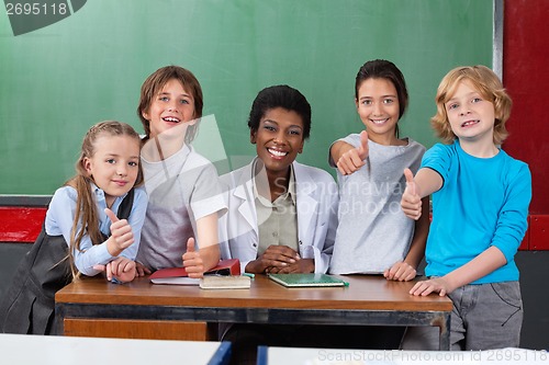 Image of Schoolchildren Gesturing Thumbs Up