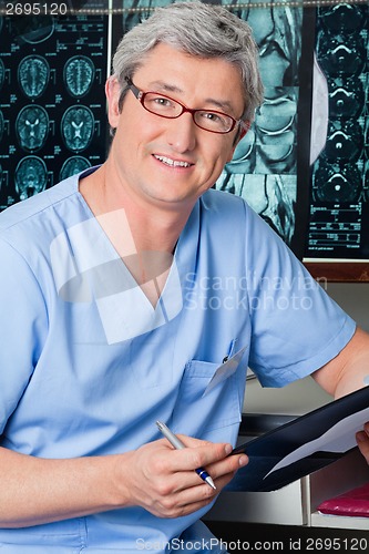 Image of Male Doctor Holding Clipboard