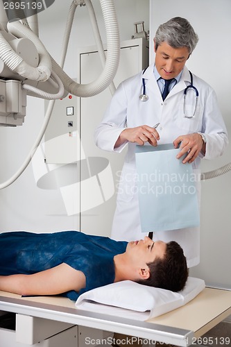 Image of Male Radiologist With Patient