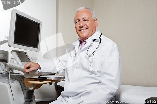 Image of Radiologist Sitting By Ultrasonic Machine