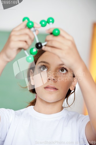 Image of Schoolgirl Looking At Molecular Structure