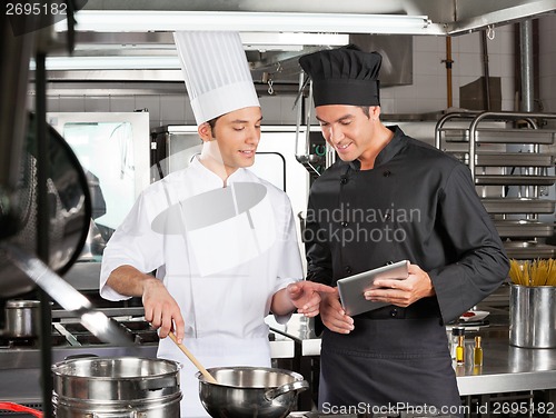 Image of Male chefs Preparing Food Together