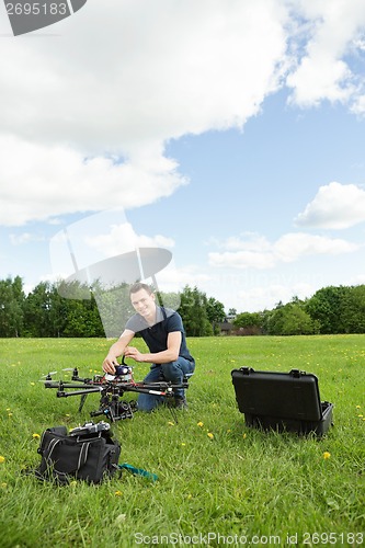 Image of Technician Assembling UAV Helicopter