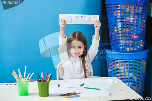 Image of Girl Showing Drawing In Classroom