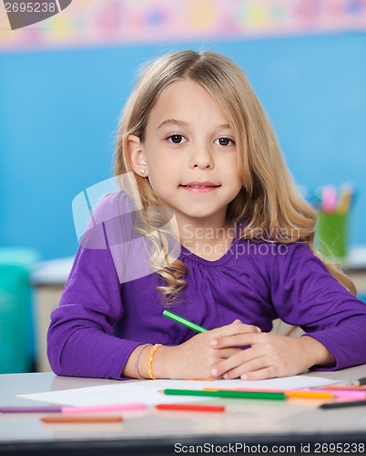 Image of Girl With Colored Sketch Pens And Paper At Desk