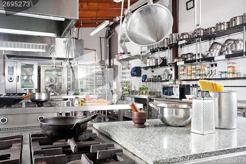 Image of Utensils On Counter In Commercial Kitchen