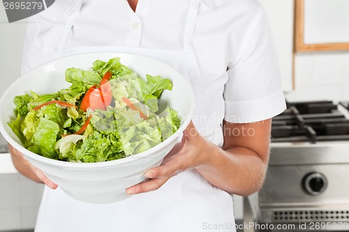 Image of Female Chef Presenting Salad