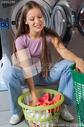 Image of Woman With Clothes Basket At Laundry