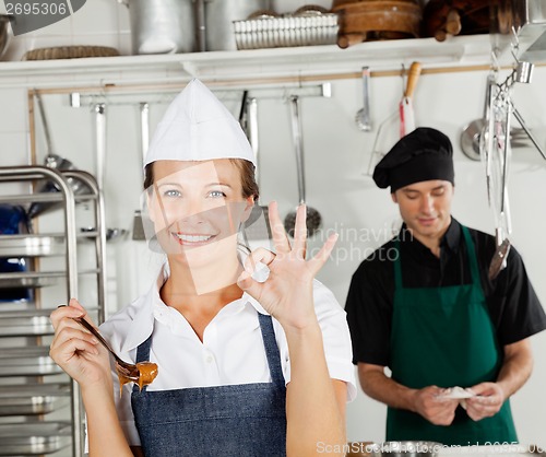 Image of Happy Female Chef Gesturing Okay Sign