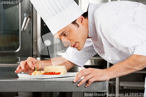 Image of Chef Garnishing Dish