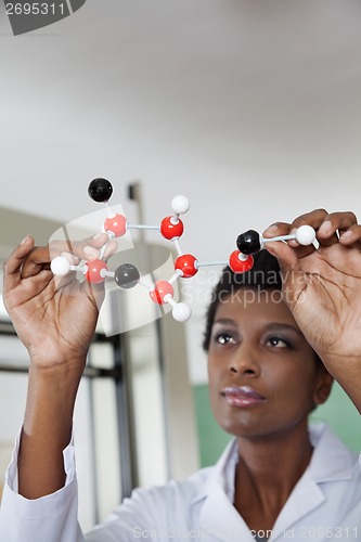 Image of Teacher Looking At Molecular Structure In Lab