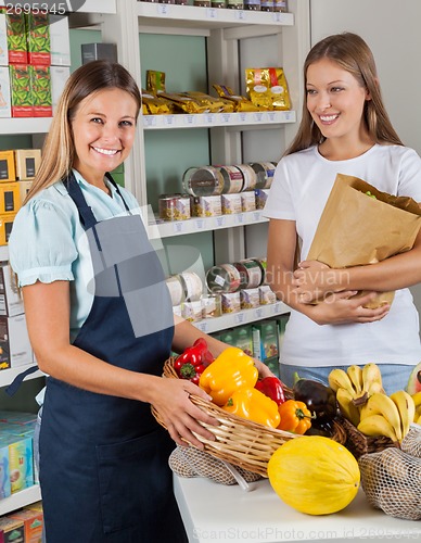 Image of Saleswoman Holding Vegetable Basket