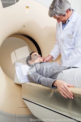 Image of Female Going Through CT Scan Test