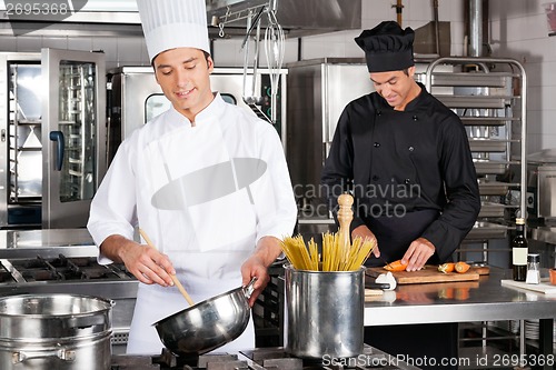 Image of Happy Chefs Preparing Food