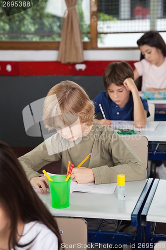 Image of Schoolchildren Studying In Classroom