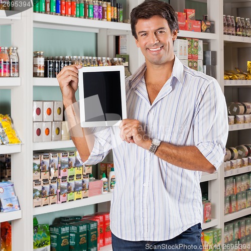 Image of Man Showing Tablet In Supermarket