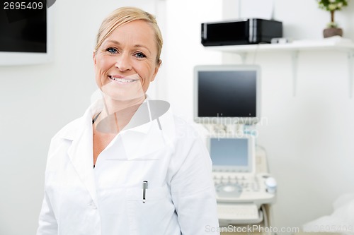 Image of Smiling Gynecologist With Ultrasound Machine