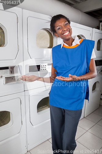 Image of Female Helper Gesturing In Laundry