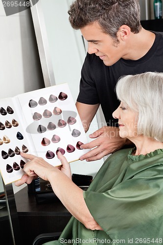 Image of Client And Hairdresser Selecting Hair Color