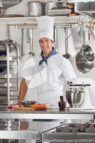 Image of Confident Chef Standing In Restaurant Kitchen