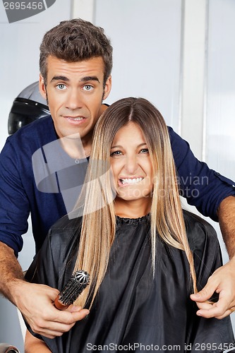 Image of Hair Dresser And Client Making Faces