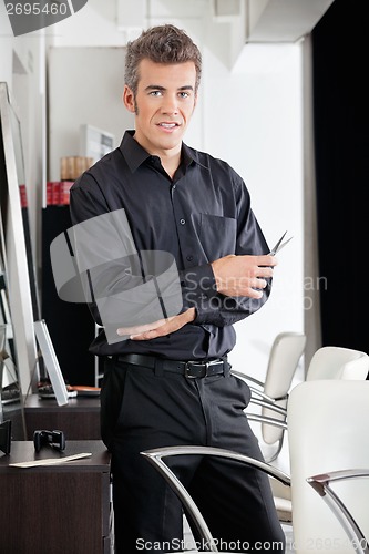 Image of Male Hairstylist With Scissors At Salon