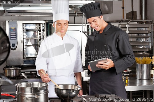 Image of Chefs Preparing Food In Kitchen