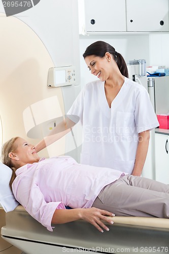 Image of Radiologic Technician Looking At Patient